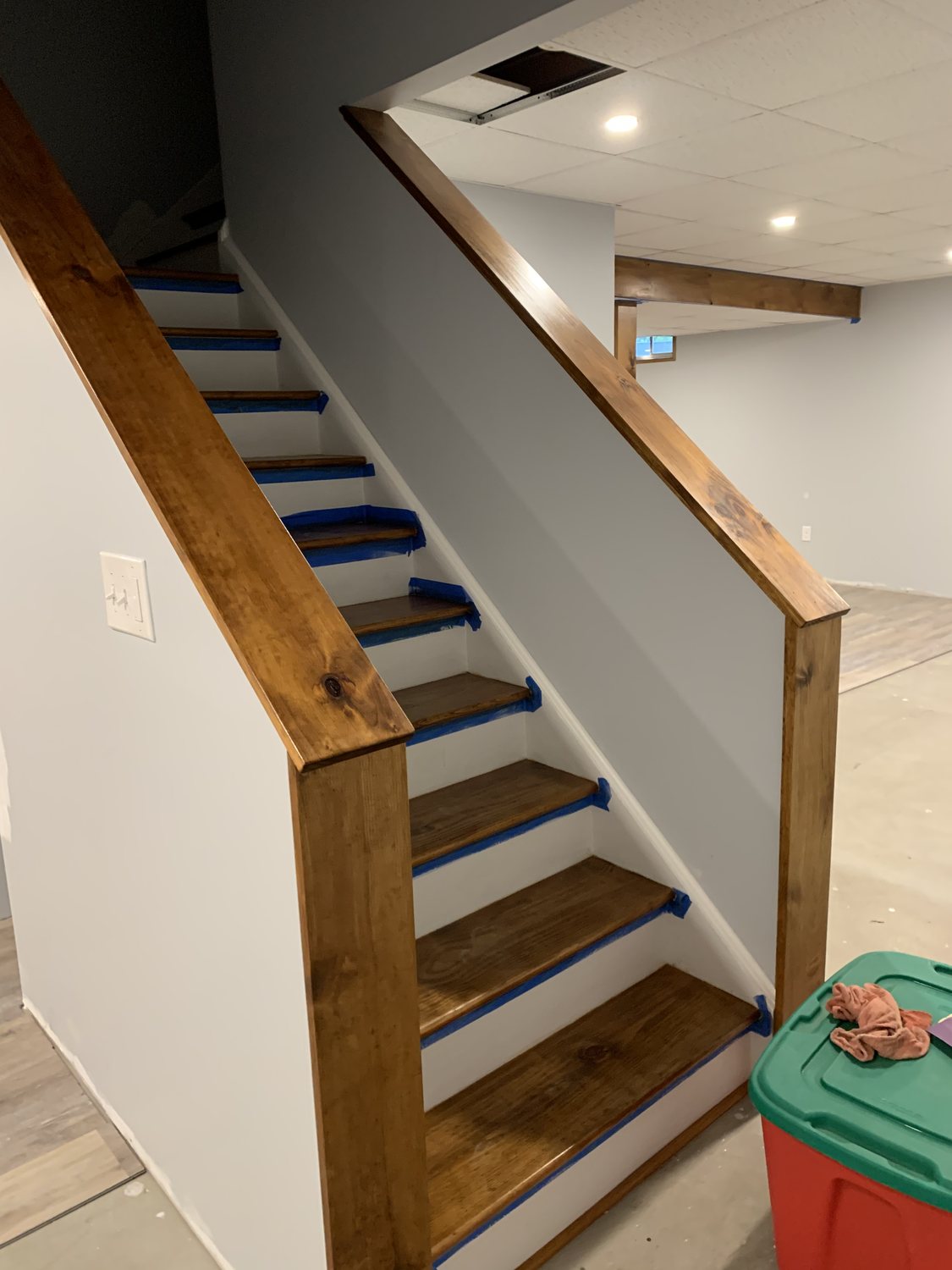 Finished wood stairs with matching handrails